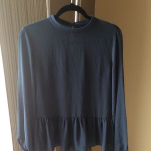 Long sleeved blouse with peplum bottom